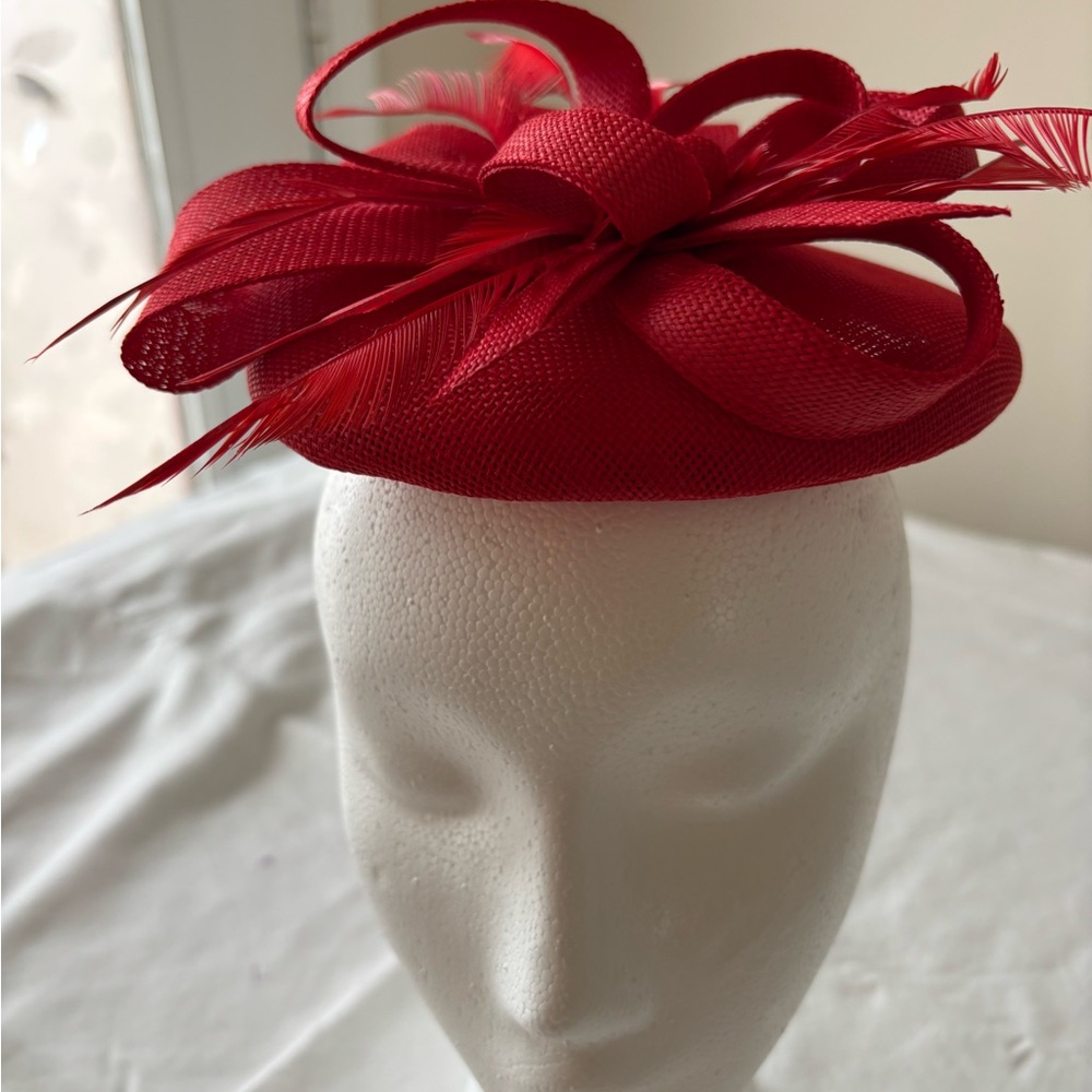 Vibrant Red Sculptural Hat with Bow and Feathers